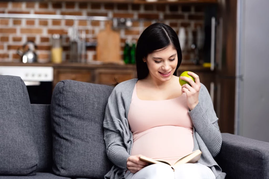 the stork bag - Mommy Picks Top 5 Pregnancy Reads - pregnant woman reading